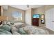 Cozy bedroom with two beds, soft bedding, and stylish furnishings at 7673 Heritage Crossing Way # 301, Reunion, FL 34747