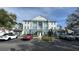Attractive three-story condo building with classic architectural details and ample parking at 7673 Heritage Crossing Way # 301, Reunion, FL 34747