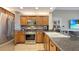Well-equipped kitchen with stainless steel appliances, granite countertops, and ample cabinet space at 7673 Heritage Crossing Way # 301, Reunion, FL 34747