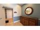 Well-kept building lobby with a wooden accent wall, tiled floors, and an elevator at 7673 Heritage Crossing Way # 301, Reunion, FL 34747