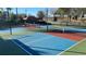 Outdoor pickleball court, perfect for friendly matches and staying active within the community amenities at 7673 Heritage Crossing Way # 301, Reunion, FL 34747