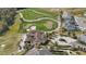 Gorgeous home nestled in a golf course community with circular driveway and palm trees at 785 Desert Mountain Ct, Reunion, FL 34747