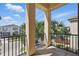 Cozy balcony with tiled floor and black iron railing offering neighborhood views at 785 Desert Mountain Ct, Reunion, FL 34747