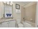 Well-lit bathroom featuring a shower-tub combination and granite vanity at 785 Desert Mountain Ct, Reunion, FL 34747