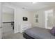 Upstairs bedroom featuring plush carpeting and access to the bath at 785 Desert Mountain Ct, Reunion, FL 34747