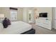 Well lit bedroom featuring plush carpet and balcony access at 785 Desert Mountain Ct, Reunion, FL 34747