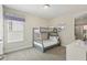 Bunk beds in a carpeted bedroom featuring a window with blinds and a dresser at 785 Desert Mountain Ct, Reunion, FL 34747