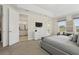 Spacious main bedroom with access to the bathroom, a private balcony, and large bright windows at 785 Desert Mountain Ct, Reunion, FL 34747