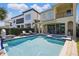 Relaxing outdoor living with a private pool, spa, and lounge area between two homes at 785 Desert Mountain Ct, Reunion, FL 34747
