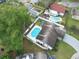 Inviting home with a refreshing pool, situated in a well-maintained yard, providing an ideal retreat for relaxation at 7924 Coot St, Orlando, FL 32822