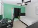 Bedroom featuring desk, chair, and ceiling fan, ideal for work and relaxation at 7924 Coot St, Orlando, FL 32822