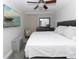 Primary bedroom with neutral walls, TV, and ceiling fan, offering a peaceful retreat at 7924 Coot St, Orlando, FL 32822