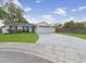Attractive single-story home with a well-maintained lawn and a curved driveway on a quiet cul-de-sac at 7924 Coot St, Orlando, FL 32822