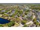 An aerial view of a neighborhood with lush green trees and community amenities and landscaping at 808 Golfpark Dr, Celebration, FL 34747