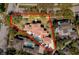 An aerial view of a beautiful home surrounded by mature trees, showcasing its prime location at 808 Golfpark Dr, Celebration, FL 34747