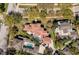 An aerial view shows the property surrounded by mature trees, highlighting its prime location at 808 Golfpark Dr, Celebration, FL 34747