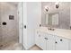 Bright bathroom with a glass door shower and marble countertops at 808 Golfpark Dr, Celebration, FL 34747