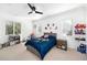 Charming bedroom featuring a playful decor, ceiling fan, and natural light, creating a fun and inviting space at 808 Golfpark Dr, Celebration, FL 34747