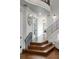 Grand entryway with hardwood floors, elegant staircase, and soaring ceilings at 808 Golfpark Dr, Celebration, FL 34747