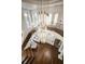 Open foyer with a grand chandelier, staircase, and hardwood floors, offering a welcoming entrance at 808 Golfpark Dr, Celebration, FL 34747