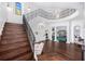 Bright foyer showcasing hardwood floors, staircase with iron railings and architectural details at 808 Golfpark Dr, Celebration, FL 34747