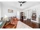 Bright home office features hardwood floors, white walls, and a comfortable leather chair at 808 Golfpark Dr, Celebration, FL 34747