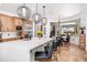 Modern kitchen with large center island, designer lighting, and luxury appliances at 808 Golfpark Dr, Celebration, FL 34747