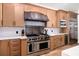 Beautiful kitchen with stainless steel appliances, large island, and abundant counterspace at 808 Golfpark Dr, Celebration, FL 34747