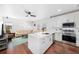 Open-concept kitchen with white cabinets and stainless steel appliances at 808 Golfpark Dr, Celebration, FL 34747