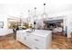 Open concept kitchen featuring a large island, modern finishes, and stainless steel appliances at 808 Golfpark Dr, Celebration, FL 34747