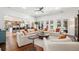 Bright living room features hardwood floors, and comfortable seating for entertaining at 808 Golfpark Dr, Celebration, FL 34747