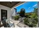 Relaxing patio area with comfortable seating, lush landscaping, and a sunny sky at 808 Golfpark Dr, Celebration, FL 34747