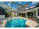 Inviting backyard pool with spa, screened enclosure, and plenty of room for relaxation and entertainment at 808 Golfpark Dr, Celebration, FL 34747