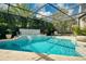 Sparkling pool featuring a spa, lush landscaping, and a screened enclosure for year-round enjoyment at 808 Golfpark Dr, Celebration, FL 34747