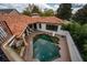 Aerial view of a home with a private pool and outdoor entertaining space at 8437 Lake Burden Cir, Windermere, FL 34786