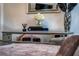 Close-up view of a mirrored cabinet with vases, flowers, books, and other tasteful decor elements at 8437 Lake Burden Cir, Windermere, FL 34786