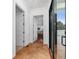 A hallway with tile flooring leading to a bedroom with a sliding door to the outside at 8437 Lake Burden Cir, Windermere, FL 34786