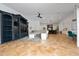 An open-concept living space with tan ceramic tile flooring and adjoined kitchen and dining areas at 8437 Lake Burden Cir, Windermere, FL 34786