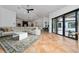 Spacious living room boasts tile floors, an open layout, and sliding glass doors to the outdoor space at 8437 Lake Burden Cir, Windermere, FL 34786