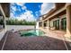 Beautiful pool area with outdoor kitchen, lounge seating, and well-maintained brick patio at 8437 Lake Burden Cir, Windermere, FL 34786