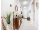 Hallway featuring tiled flooring, recessed lighting, and stylish decorations at 9158 Elsa Ct, Davenport, FL 33897