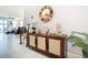 Charming foyer with a stylish console table and a decorative mirror at 9158 Elsa Ct, Davenport, FL 33897