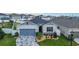 Charming single-Gathering home with a blue garage door, stone accents, and decorative driveway at 9158 Elsa Ct, Davenport, FL 33897