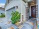Single-Gathering home with brick accents, a blue garage door and a decorative driveway at 9158 Elsa Ct, Davenport, FL 33897