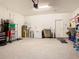 Spacious garage with ample storage space and a water heater at 9158 Elsa Ct, Davenport, FL 33897