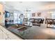 Modern kitchen with granite countertops and an island with a stainless steel sink at 9158 Elsa Ct, Davenport, FL 33897