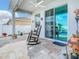 Cozy covered patio perfect for outdoor relaxation with tile flooring at 9158 Elsa Ct, Davenport, FL 33897