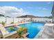 Backyard pool and spa area with beautiful landscaping, creating a private and tranquil retreat at 9158 Elsa Ct, Davenport, FL 33897