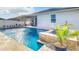 Stunning pool featuring a spa and lush landscaping for ultimate relaxation and enjoyment in the backyard at 9158 Elsa Ct, Davenport, FL 33897