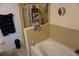 Bathroom with tub and tiled walls at 1217 Honey Blossom Dr, Orlando, FL 32824